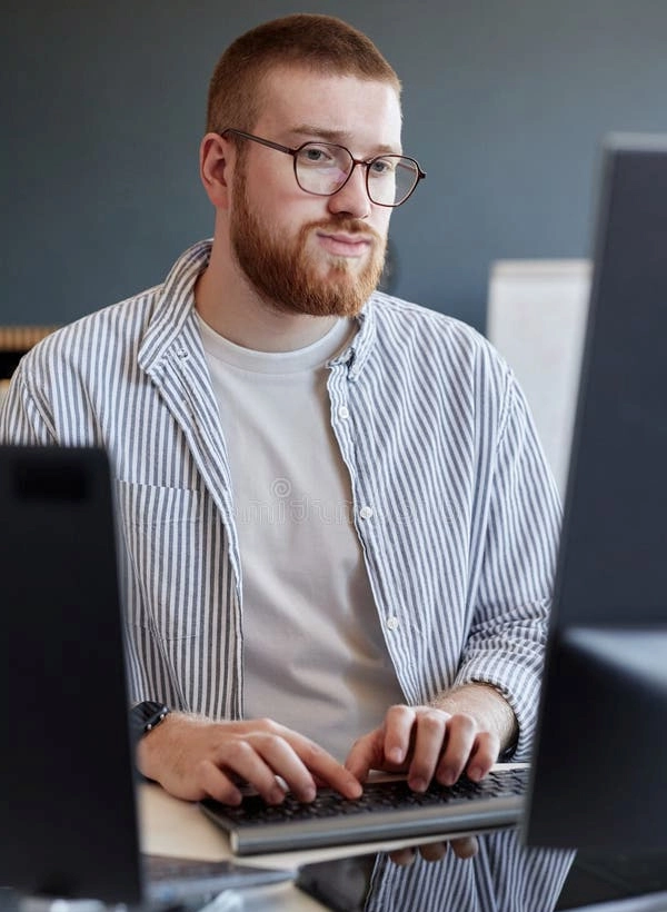 Guy working on his computer